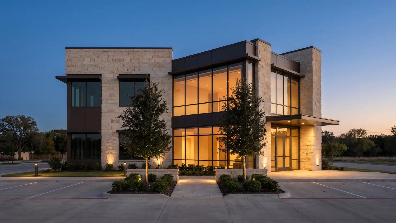 A limestone office entrance glowing in the early evening